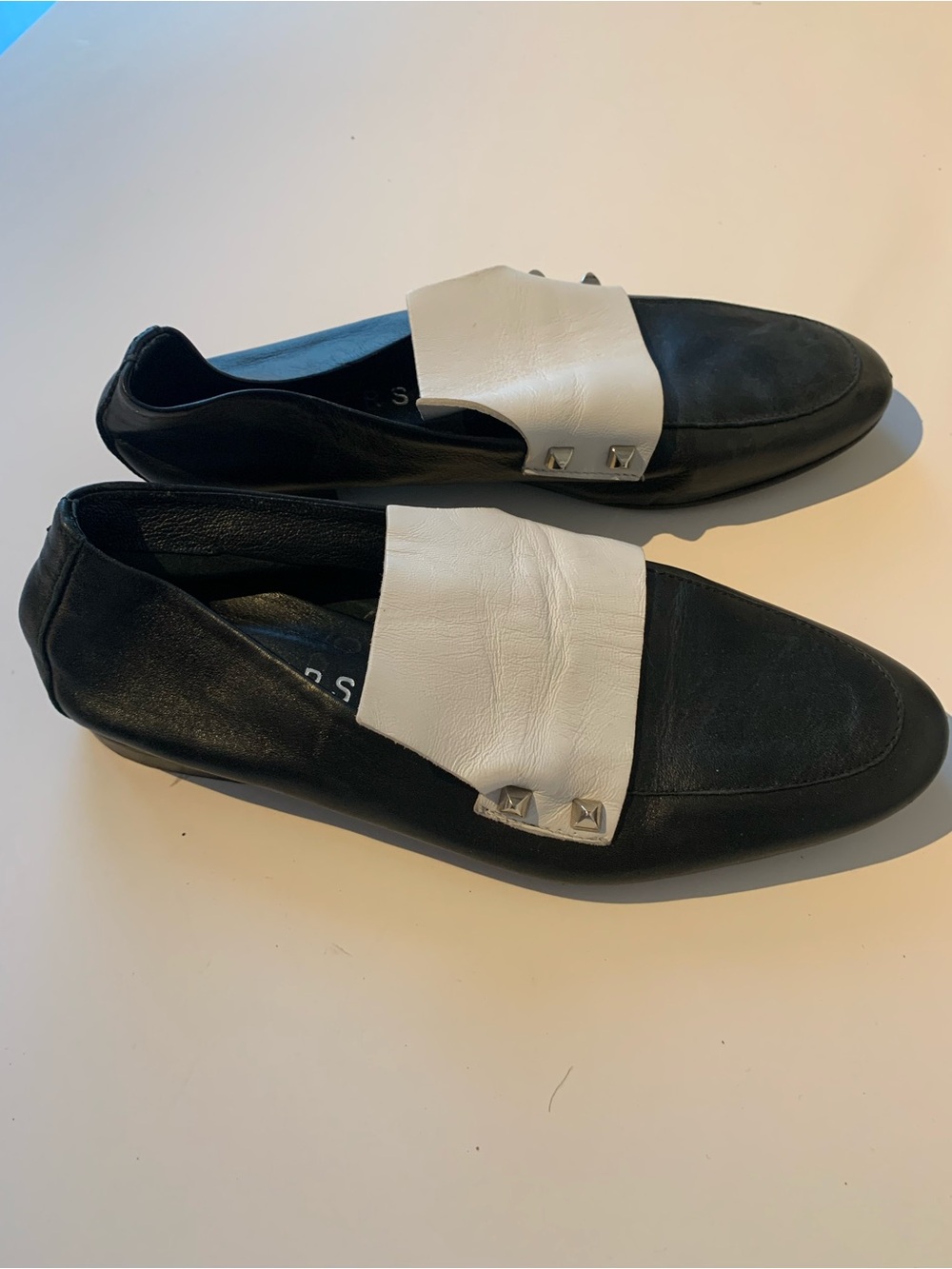 Ateliers Tuxedo Black and White Leather Slip-On Loafers with Stud Accent